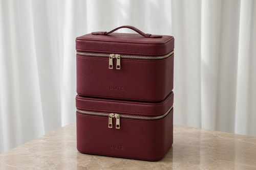 DUTE vanity cases styled on a marble table